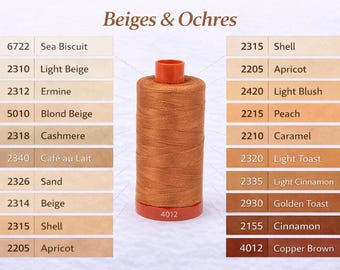 May include: A spool of copper-brown thread is centered in the image, with a red base and orange top. The image is labeled "Beiges & Ochres" and features color swatches with names like "Sea Biscuit," "Apricot," and "Cinnamon."