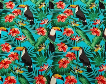 May include: A vibrant turquoise fabric featuring a tropical pattern. The design includes toucans with yellow beaks, red hibiscus flowers, and green palm leaves. The repeating pattern creates a lively and colorful design.
