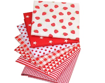 May include: A stack of eight red and white fabric squares with different patterns, including strawberries, stars, polka dots, gingham, and triangles.