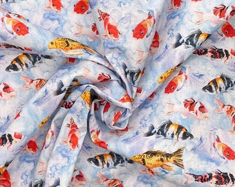 May include: A fabric featuring a repeating pattern of koi fish in shades of orange, black, and white, set against a light blue watercolor-style background. The textile displays multiple fish swimming in various directions across the surface.