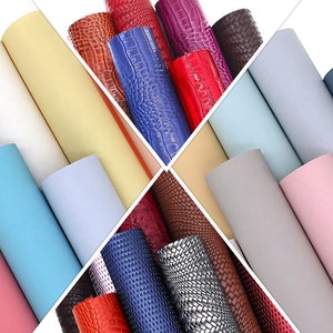 Puede incluir: Surtido de láminas de polipiel enrolladas en varios colores y texturas. Incluye patrones lisos, grabados y tejidos en tonos blanco, amarillo, rosa, azul, rojo y gris. Ideal para manualidades y proyectos DIY.