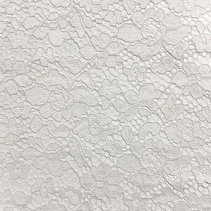 May include: White lace fabric with a delicate floral pattern.