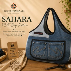 May include: A denim tote bag featuring two front pockets with zigzag stitching, black trim, and a black mesh handle. The bag is displayed alongside a sign reading SAHARA PDF Bag Pattern, a basket of fabric, a measuring tape, and scissors.