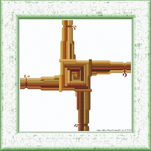 May include: A cross-shaped design with a woven pattern in shades of brown, beige, and gold. The design is framed in a white frame with a green border.