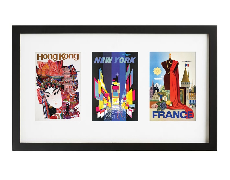 May include: A black framed triple picture frame with three vintage travel posters. The posters feature images of Hong Kong, New York City, and France.
