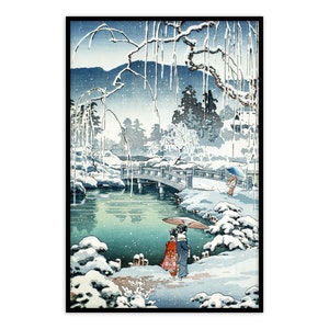 May include: A Japanese woodblock print depicting a snowy landscape with a bridge over a pond. Two figures in traditional clothing walk across the bridge, each holding an umbrella. The scene is framed by snow-covered trees and a mountain in the background.