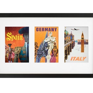 May include: A black framed picture with three vintage travel posters. The posters are for Spain, Germany, and Italy. The Spain poster features a bullfighter in a red and yellow suit. The Germany poster features a castle and a woman in a white dress. The Italy poster features a view of Venice with a plane flying overhead.