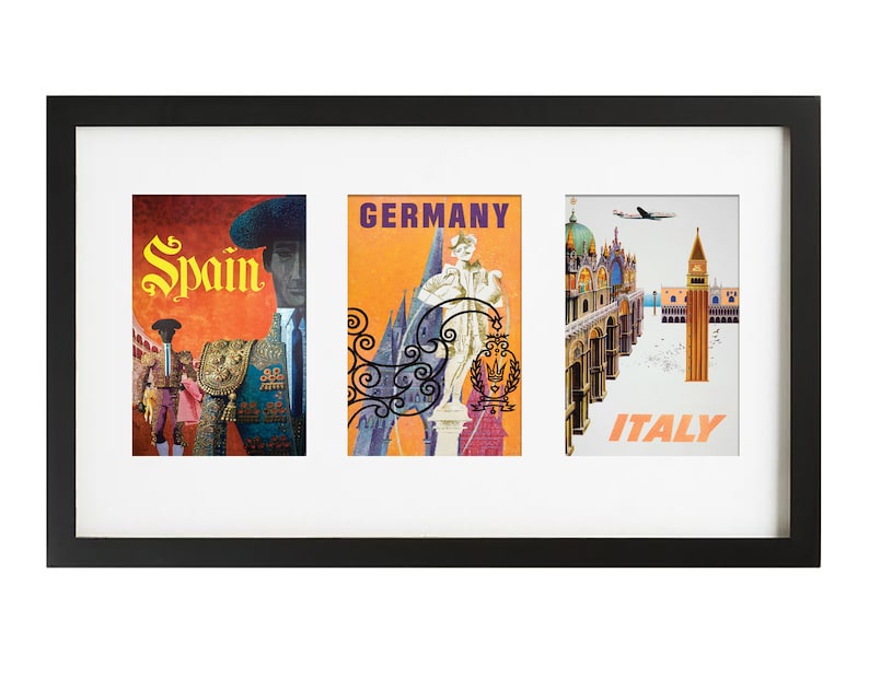 May include: A black framed picture with three vintage travel posters. The posters are for Spain, Germany, and Italy. The Spain poster features a bullfighter in a red and yellow suit. The Germany poster features a castle and a woman in a white dress. The Italy poster features a view of Venice with a plane flying overhead.