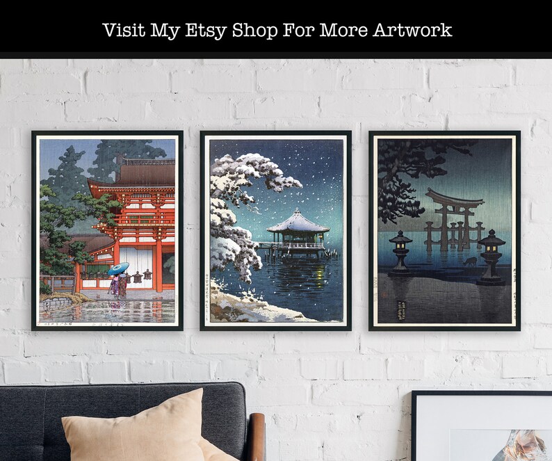 May include: Three framed Japanese woodblock prints depicting scenes of a red temple, a snow-covered gazebo, and a torii gate in the water. The prints are displayed on a white brick wall.
