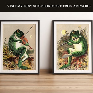 K&ouml;nnte beinhalten: Zwei gerahmte Illustrationen von Fr&ouml;schen, die Musikinstrumente spielen. Der Frosch links spielt Geige, der Frosch rechts spielt Fl&ouml;te. Beide Fr&ouml;sche sind gr&uuml;n mit schwarzen Flecken und sitzen auf einem Blumenbeet.