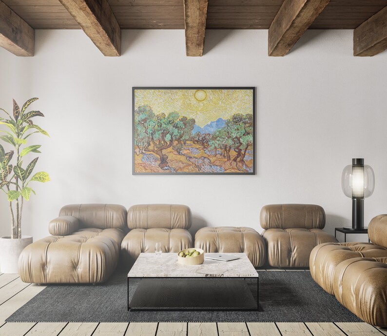 May include: A living room interior with a brown leather sectional sofa, a coffee table, a potted plant, and a framed painting of a landscape with olive trees. The painting is in a style reminiscent of Vincent van Gogh.