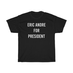 May include: Black t-shirt with white text that reads "Eric Andre for President".