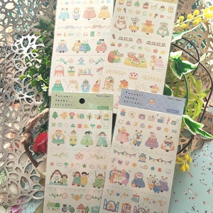 May include: Four sheets of colorful stickers featuring illustrations of cute animals, houses, and other objects. The stickers are labeled "Funwari Happy Sticker" and "Made in Japan".