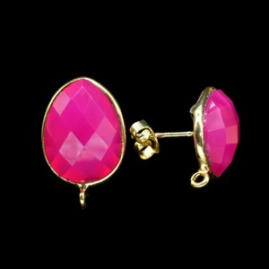 May include: A pair of pink gemstone earrings with gold settings. The earrings have a faceted, oval-shaped gemstone and a post back.