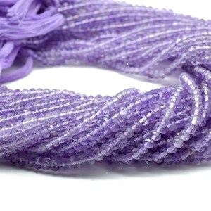 May include: A strand of light purple amethyst beads. The beads are faceted and have a slightly irregular shape. The strand is approximately 16 inches long.
