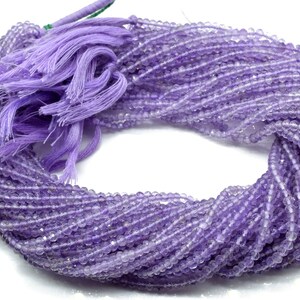 May include: A strand of light purple amethyst beads, approximately 4mm in size, with a purple tassel.