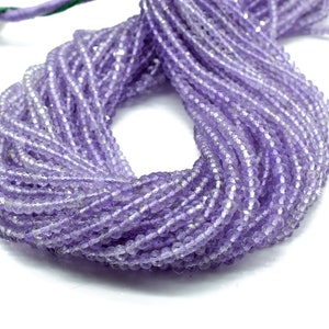 May include: A strand of light purple amethyst beads. The beads are faceted and have a slightly irregular shape. The strand is approximately 16 inches long.