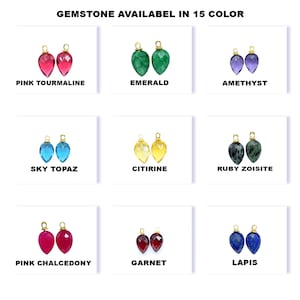 May include: A selection of gemstone pendants in various colours, including pink tourmaline, emerald, amethyst, sky topaz, citrine, ruby zoisite, pink chalcedony, garnet, and lapis. Each pendant features a gold bail.