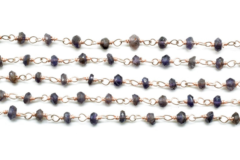 May include: A strand of faceted amethyst beads strung on a copper wire chain. The beads are a deep purple color and are approximately 4mm in size.