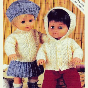 May include: A knitting pattern for doll clothes. The image shows two dolls wearing knitted outfits. One doll is wearing a blue beret, a cream-colored sweater, a blue skirt, and blue booties. The other doll is wearing a cream-colored hooded jacket and red pants.