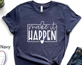 May include: A heather navy blue t-shirt with the text "make it happen" in white lettering inside a white box with a small white heart below the text.