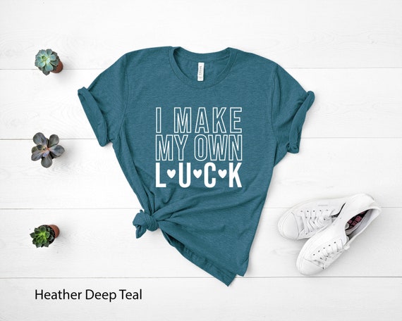 Teal shirt with white writing new arrivals