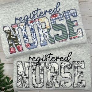 May include: Two grey sweatshirts with the words "registered NURSE" in decorative lettering. One shirt features patchwork letters with floral and patterned fabrics. The other shirt has black floral designs within the letters.