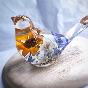 Bird shaped statuette with real flowers. Floral home decor. Resin paperweight with dandelion. Bird figurine. Flower resin sparrow.
