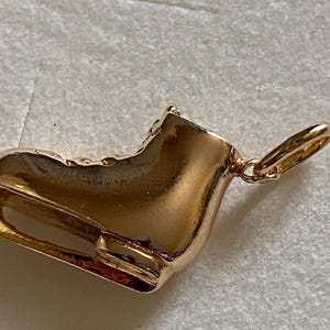 Gold plated pendant - ice skate