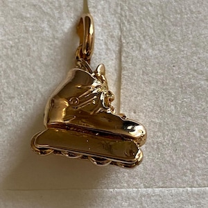 Gold plated pendant - ice skate -