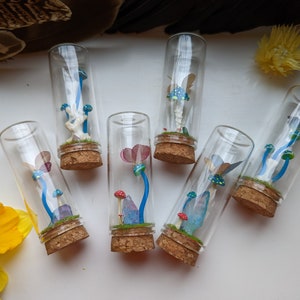 Oddity vials. Polymer clay mushrooms. Bone mushrooms. Cottagecore. Goblincore. Witches vials. Mushrooms. Bones. Curio vials. Bone vials.