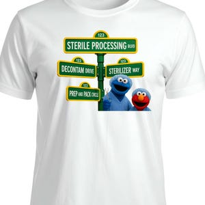 May include: White t-shirt featuring a humorous design. The graphic includes street signs with medical-themed names like "Sterile Processing Blvd" and "Decontam Drive." The design also features the characters Cookie Monster and Elmo.