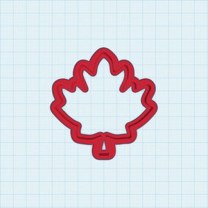 May include: A red maple leaf-shaped cookie cutter. The cutter is outlined in a darker red, with a detailed leaf shape. The background is a light blue grid pattern.