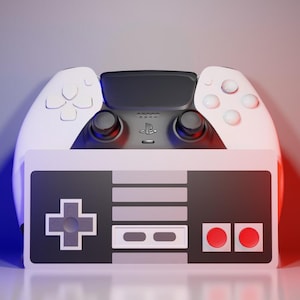 May include: A white and black video game controller with a retro design. The top portion resembles a modern controller, while the bottom half has a classic, rectangular design with a directional pad and buttons. The background has a gradient of red and blue.