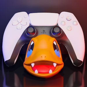 May include: A white PlayStation 5 controller with a small orange and blue Pokemon character in front of it.
