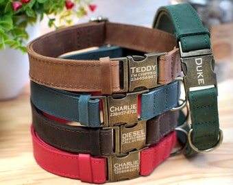 May include: A stack of personalized dog collars in various colors: brown, teal, dark brown, and red. Each collar has a metal buckle with a name and contact information engraved. The collars are made of leather.