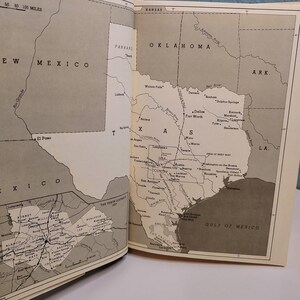May include: Open book with detailed black and white maps of the southwestern United States, including Texas, New Mexico, and Oklahoma. The maps show cities, rivers, and geographical features. The text includes the names of states and cities.