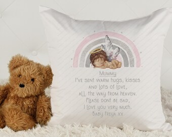 May include: A white pillow with a pink and grey rainbow design and a small angel illustration. The pillow has the text "Mummy I've sent warm hugs, kisses and lots of love, all the way from heaven. Please don't be sad. I love you very much. Baby Freya xx" printed on it.