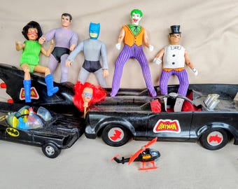 Vintage 1970's Batman action figures and accessories, Batmobiles, helicopter, sidecar. Free shipping in the continental United States.