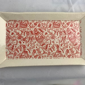Rectangular dish, red designs on white. Easter bunnies, eggs, chicks.