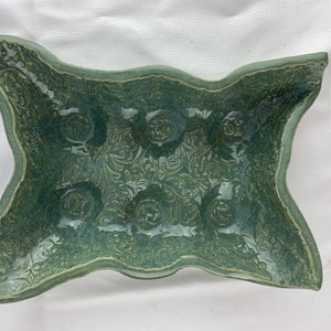 6 egg tray. Vine imprint. Minty blue/green gloss glaze. 7”x5”x2” tall.