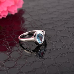 Oval Swiss Blue Topaz Sterling Silver Ring - December Birthstone