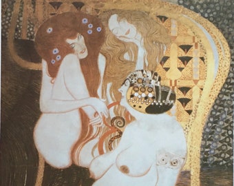 May include: A painting of three women, two with long flowing hair and one with a crown of jewels. The women are nude and have a golden background. The painting is in the style of Gustav Klimt.
