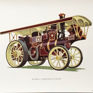 Puede incluir: Un motor de espectáculo Burrell rojo y dorado con una cubierta y ruedas grandes. El motor está sobre un fondo blanco.