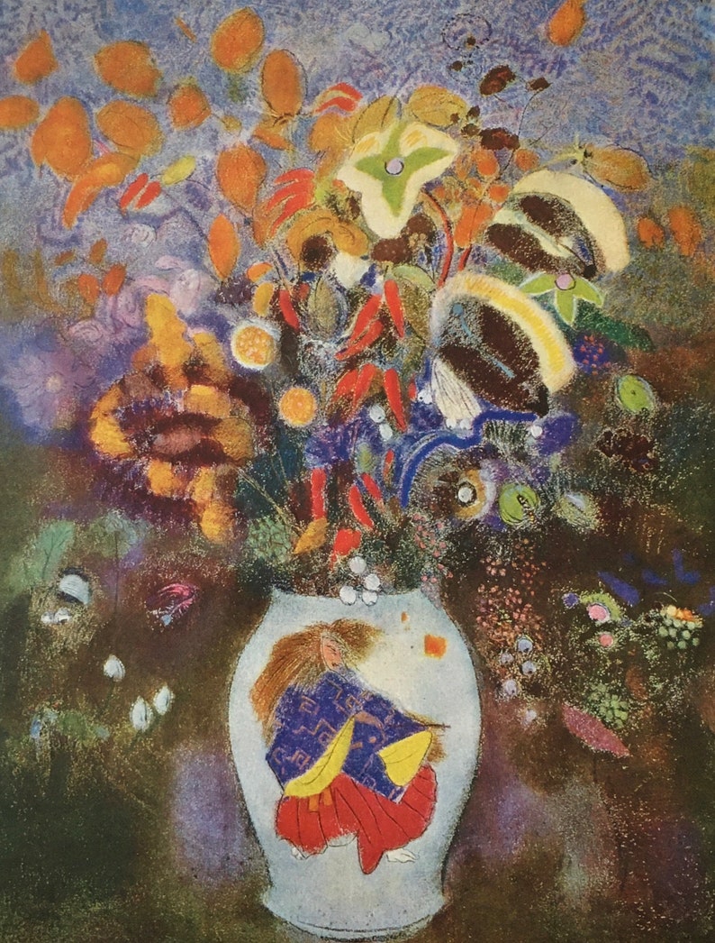 May include: A colourful bouquet of flowers in a white vase with a painted image of a woman in a blue and red dress. The flowers are a mix of orange, yellow, red, white, and blue.