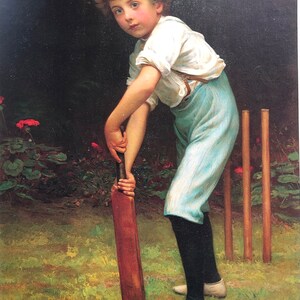 May include: A young boy in a white shirt and blue trousers holds a wooden cricket bat. He is standing in a grassy field with a set of wooden cricket stumps behind him.