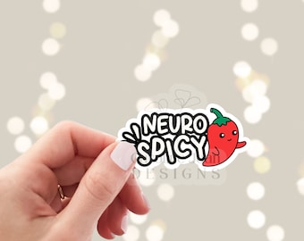 Könnte beinhalten: Ein schwarz-weißer Aufkleber mit dem Text "Neuro Spicy" und einer roten Chilischote mit grünem Stiel und einem lächelnden Gesicht.