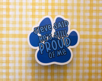 Puede incluir: Pegatina de huella de pata azul con el texto "Steve Said He's Still Proud Of Me".