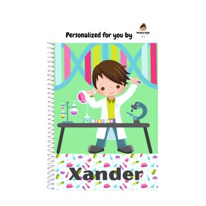 May include: A spiral-bound notebook featuring a cartoon scientist with lab equipment. The notebook has the name "Xander" on the bottom and the text "Personalized for you by" at the top. The background is light green with a science theme.