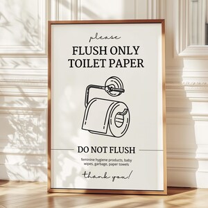 May include: A framed sign with the text "please FLUSH ONLY TOILET PAPER" and a line drawing of a toilet paper roll. Below, it reads "DO NOT FLUSH" followed by a list of items. The sign is in a wooden frame.